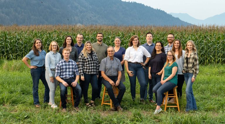 Canadian Poultry Consultants all staff professional photo in front of corn field